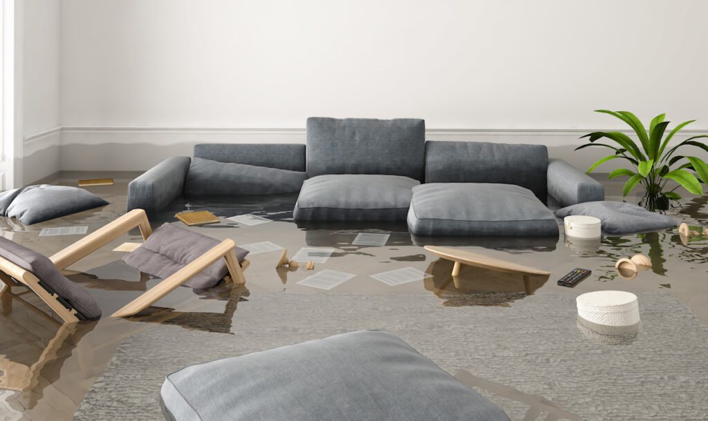 flooded room with floating furniture, water damage